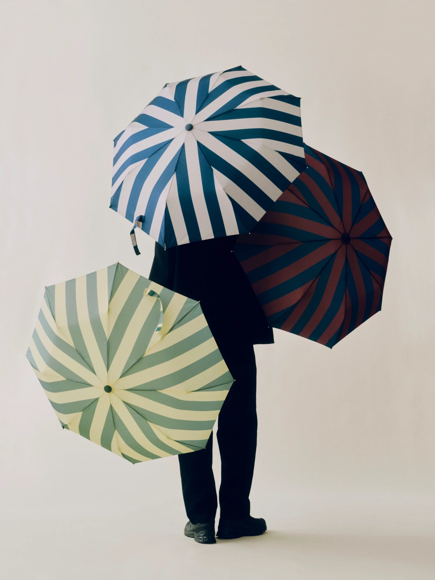 HAY Regn umbrellas held by a model
