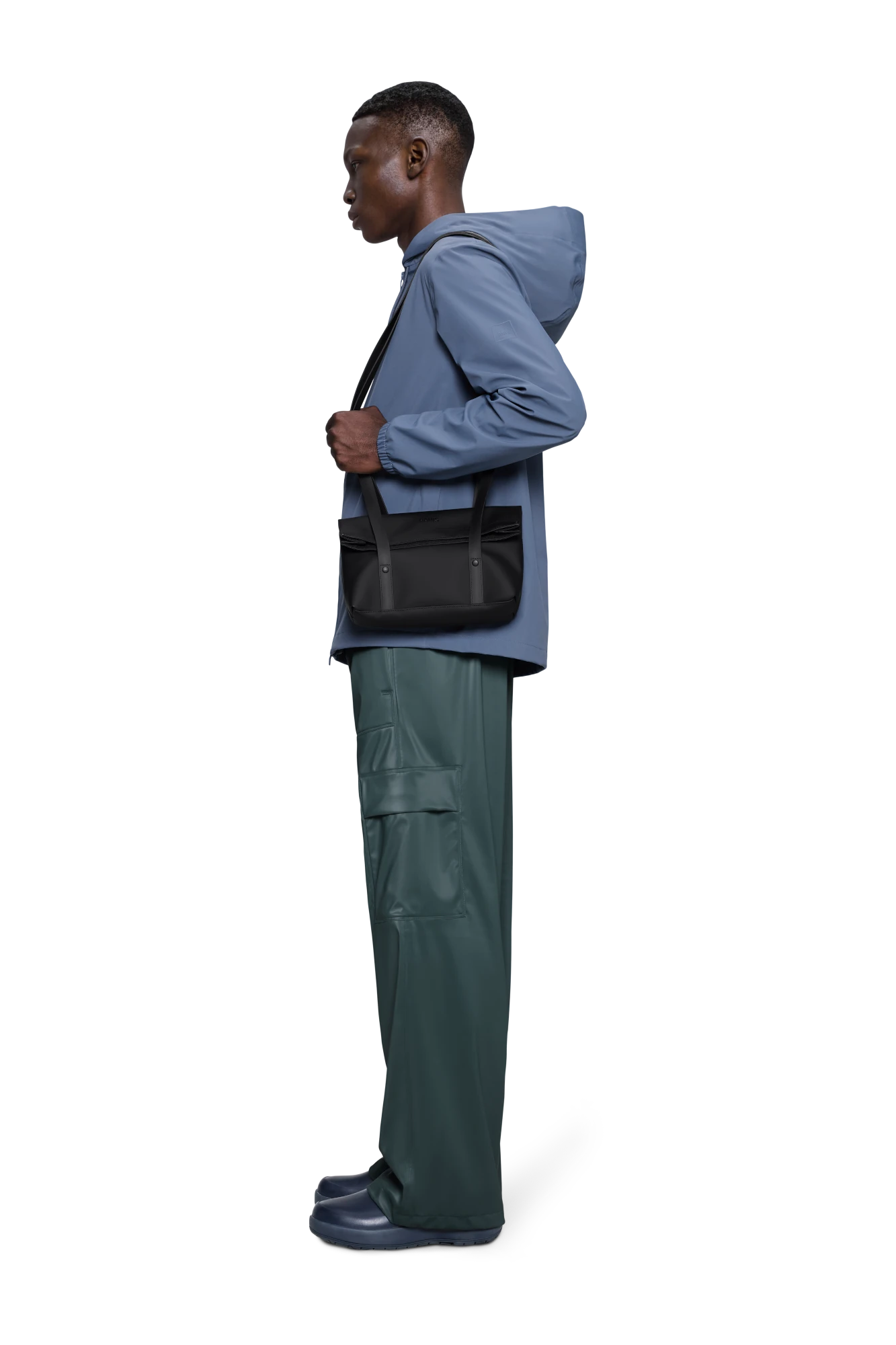 Person wearing Rains 2 Strap Crossbody Bag in Black | Lifestory