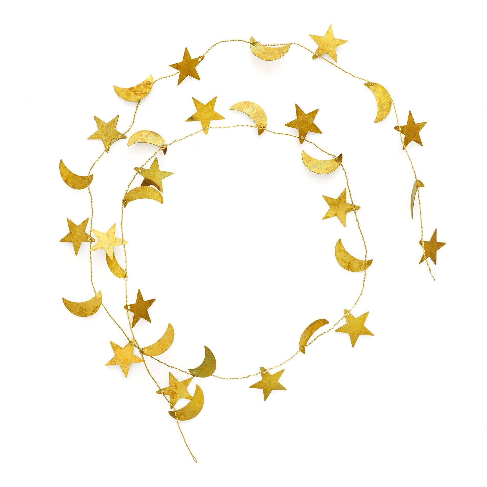 Decorative gold star and moon brass garland on a white background