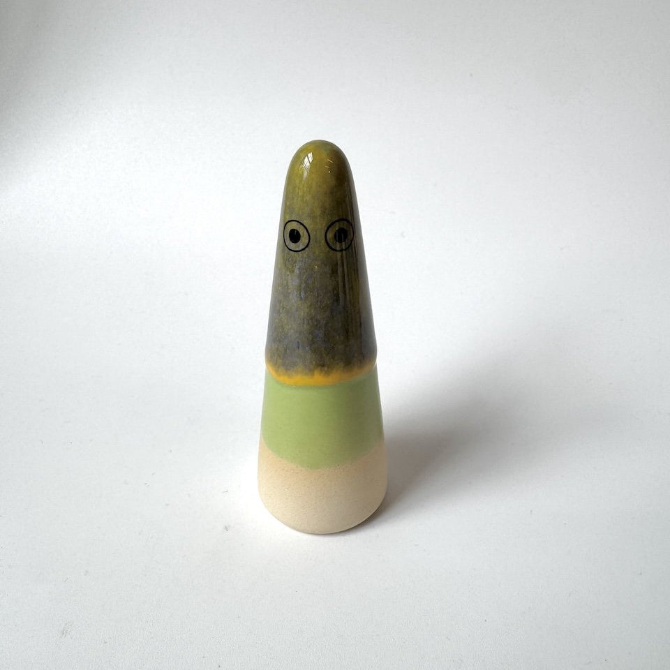 Kylie Studio Arhoj ghost olive-green top, a grey-brown middle section, a pale green band, and a cream-coloured base, standing on a plain light background.