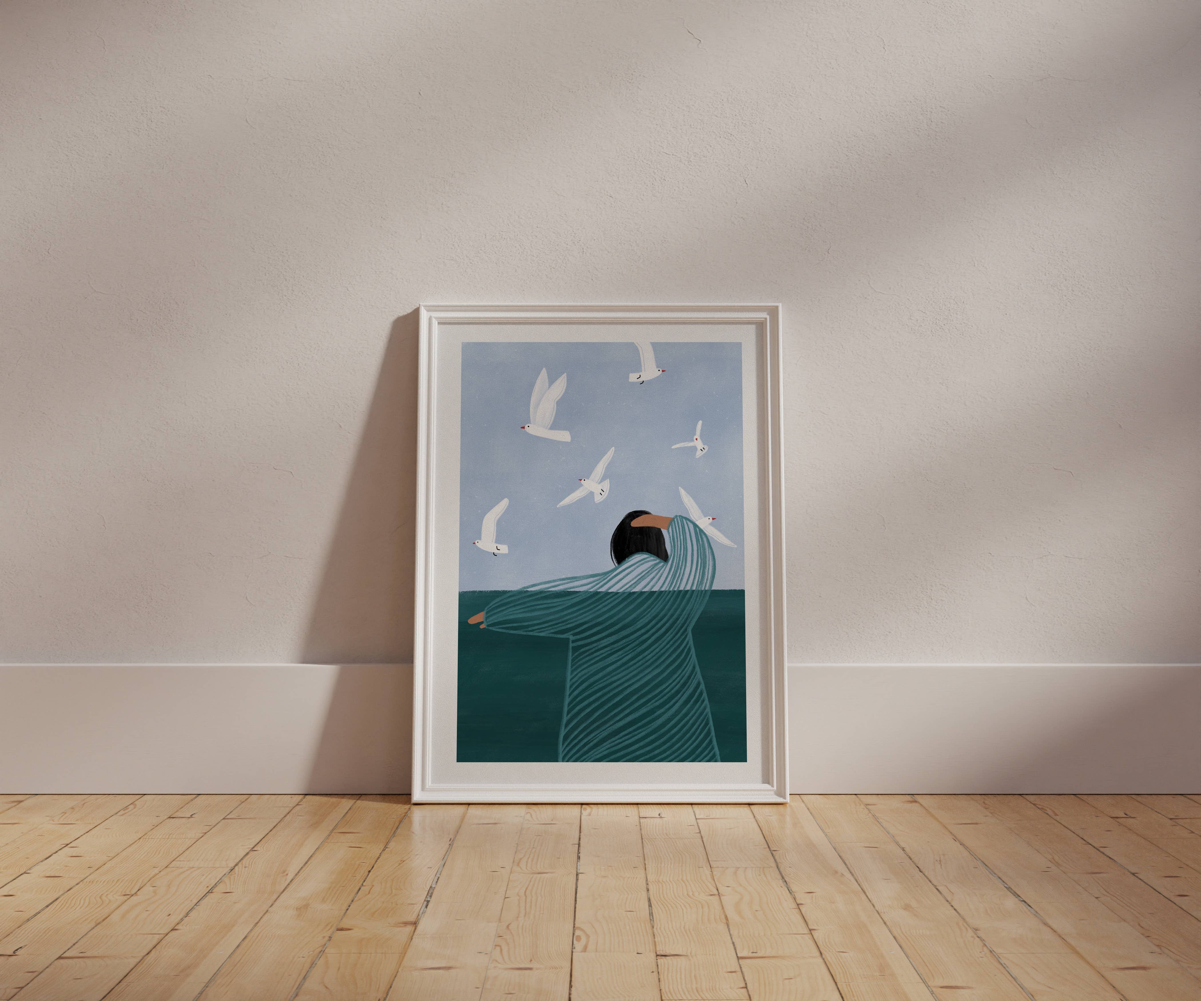 Bea Müller 'Seaside' A3 Unframed Art Print framed for reference and leaning against a bare wall