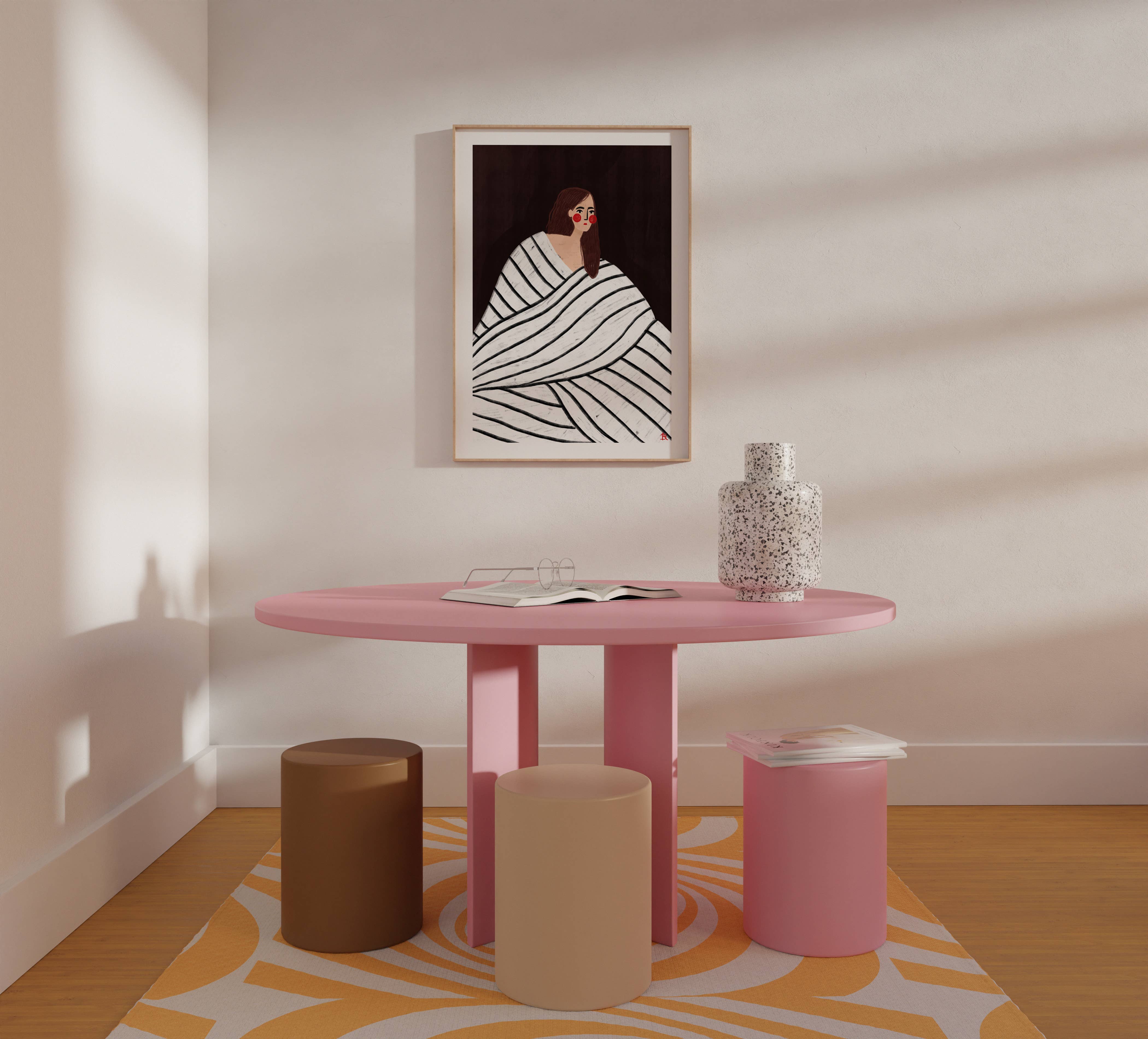 Bea Müller 'The Woman With The Black and White Stripes' A3 Unframed Art Print hanging above a pink table and low stools