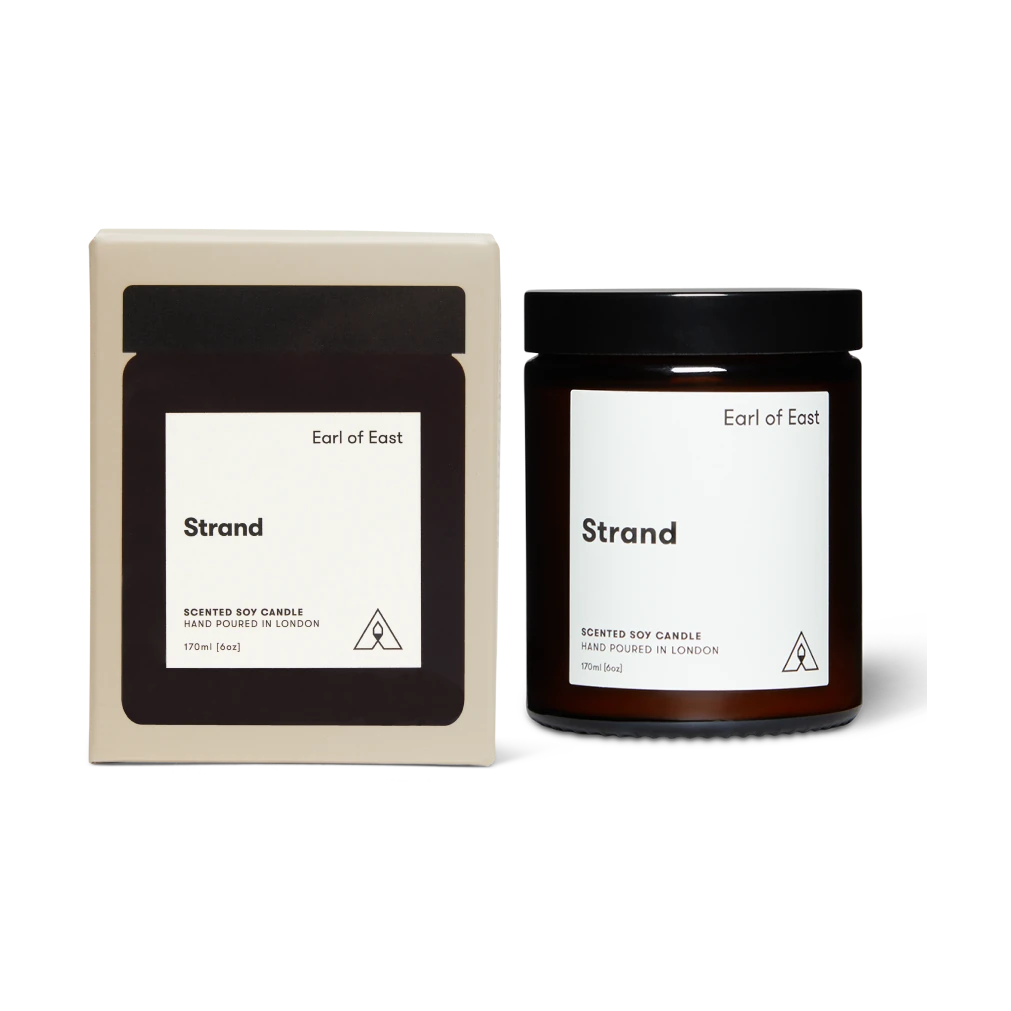 Earl of East 'Strand' scented soy candle with packaging on a white background