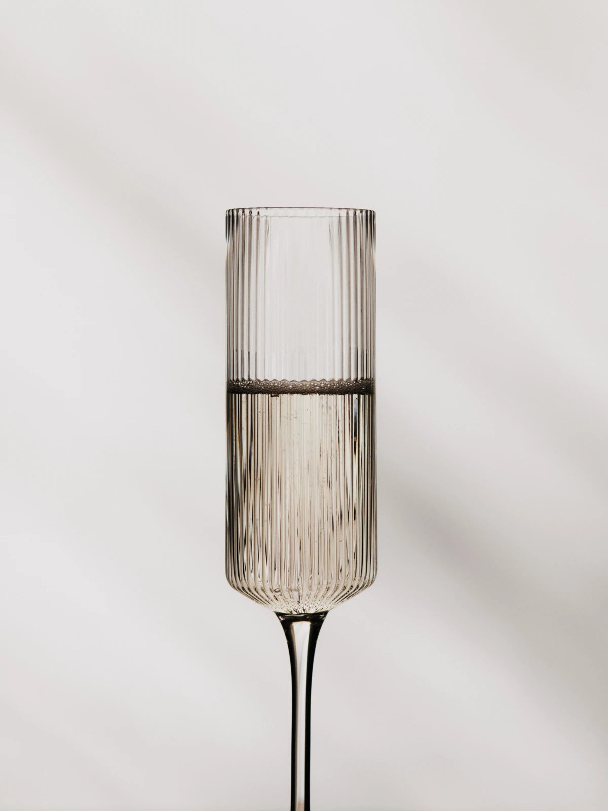 Ferm Living Set of 2 Ripple Champagne Flutes in Smoked Grey Glass - Lifestory