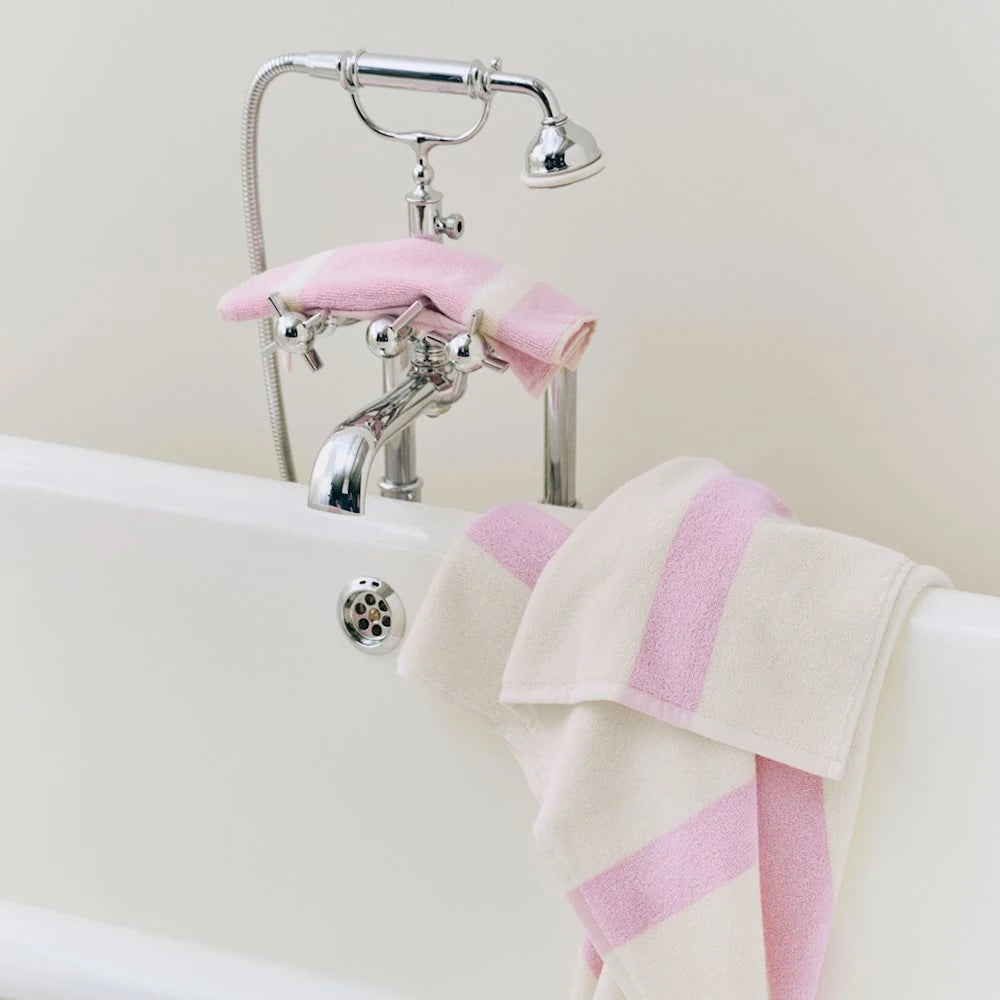 HAY Cool Pink wash cloth on a bathtub