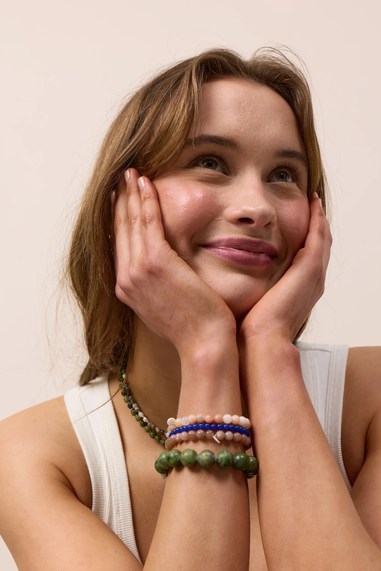 Woman wearing Soï Copenhagen essential Sunstone crystal stretch bracelet