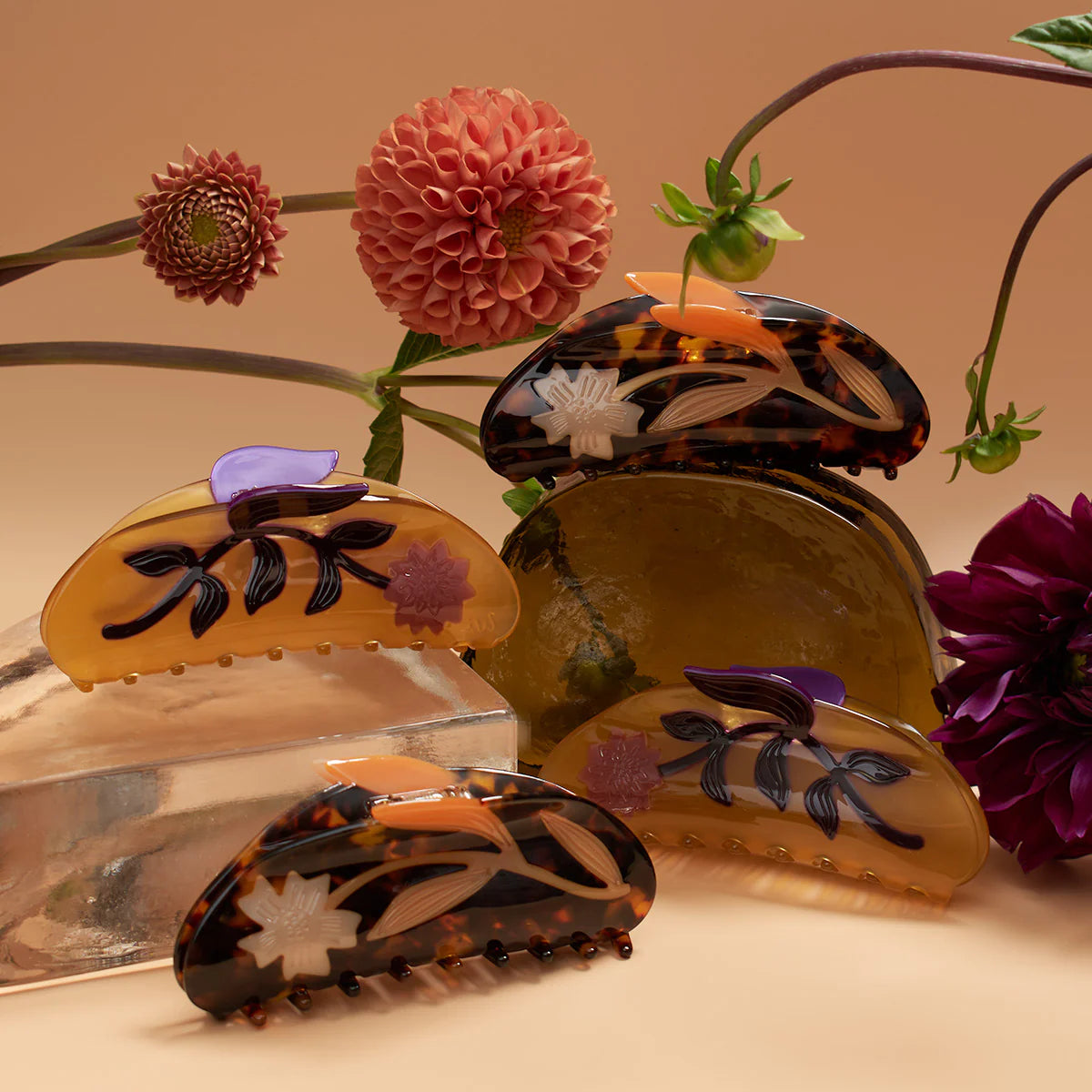 Set of floral-patterned hair clips with flowers in the background