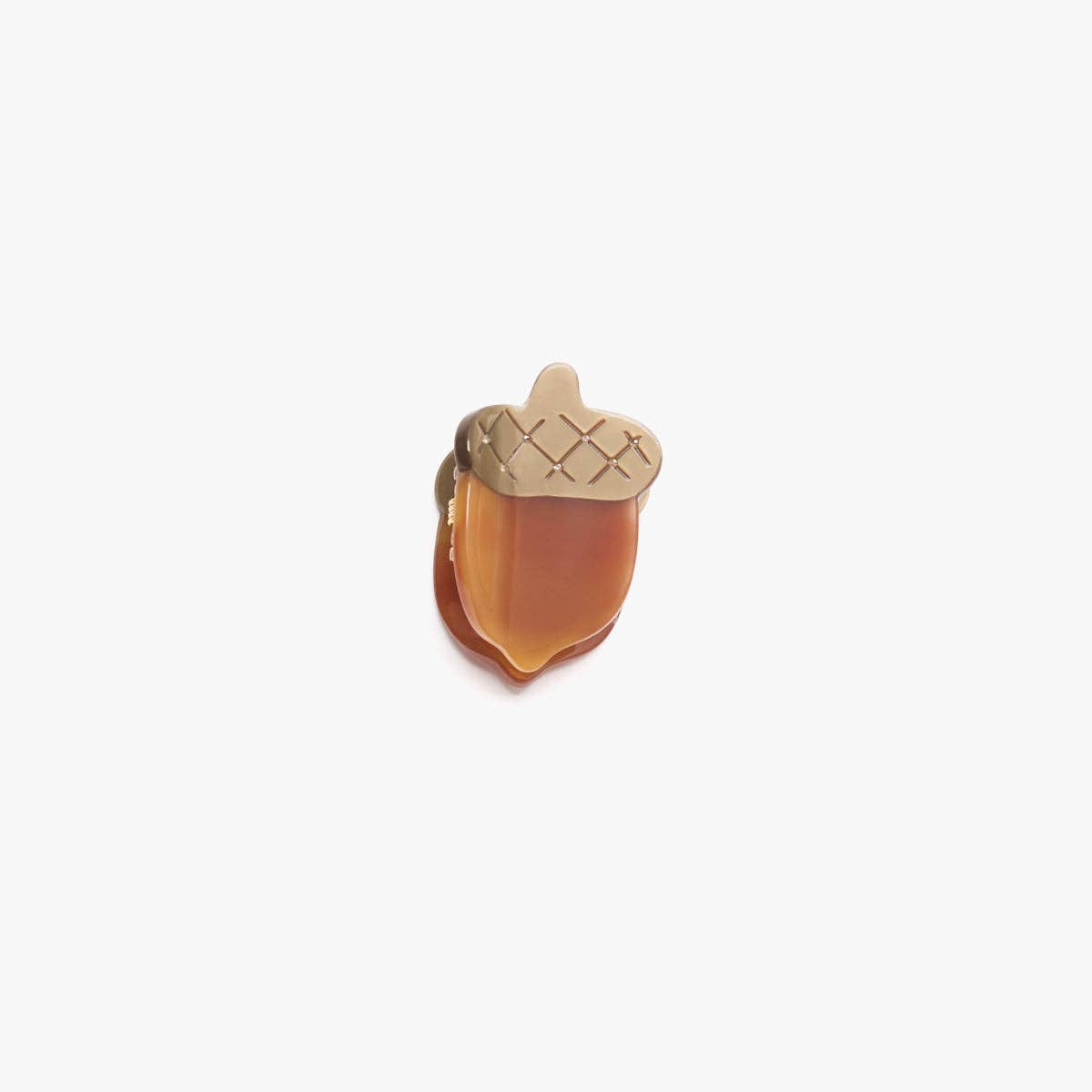 Acorn-shaped hair claw with a textured top on a white background