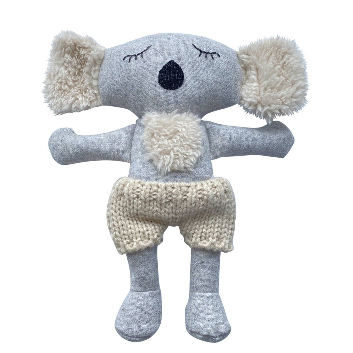 Knitted koala toy with gray body and white accents on a white background